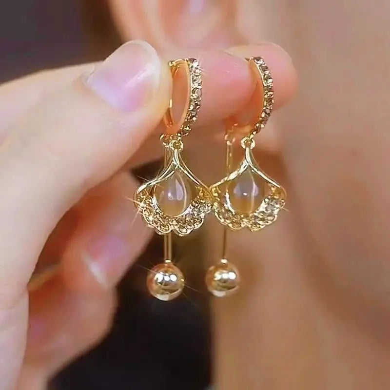 ✨【3 sztuki: zielony + biały + fioletowy】🎁Eleganckie i modne kolczyki z kocim okiem